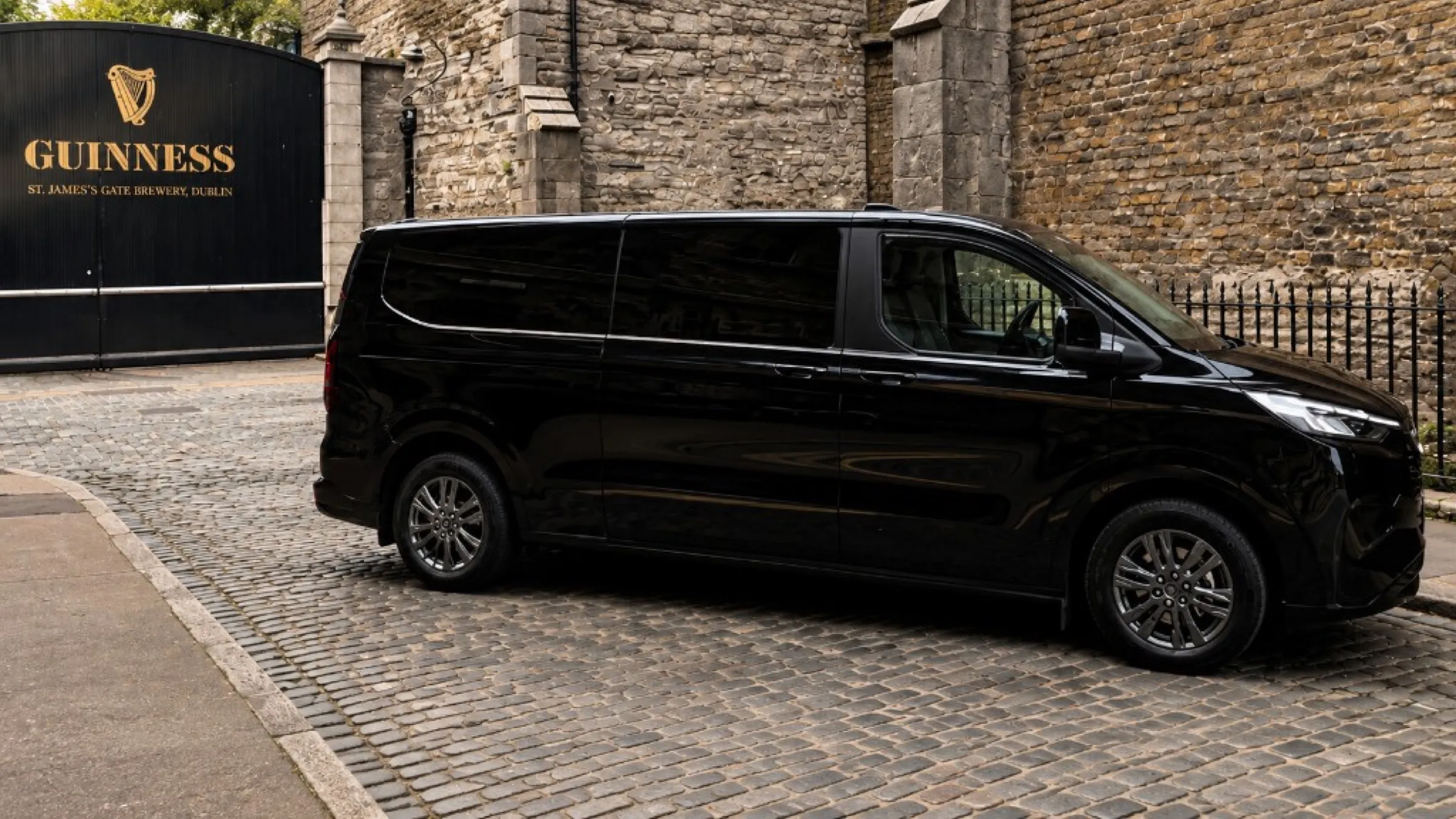A black business MPV on the cobbles at St James’s Gate, Dublin